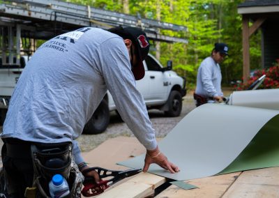 employee cutting materials on site