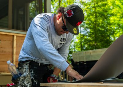 employee cutting materials on site